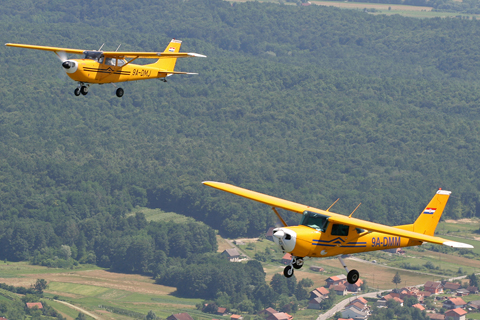 Our two canaries holding a nice, not-too-tight formation above the hilly Croatian countryside