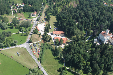 Shot from a slight bank on our first high pass. Don't know what was going on down there, but I spotted a number of Red Bull flags and two helicopters, a private Robinson R-44 Clipper II and an airforce Mil Mi-171Sh, seen here to the bottom left