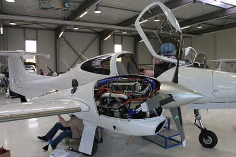 Final checks on another example. The grey stripes on the wing and stabilizers are the de-icing system elements