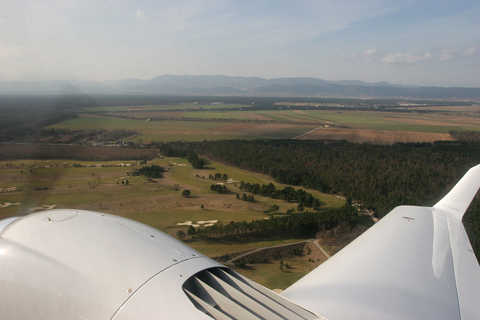 A view of the picturesque Austrian countryside, with the foothills of the Alps in the distance