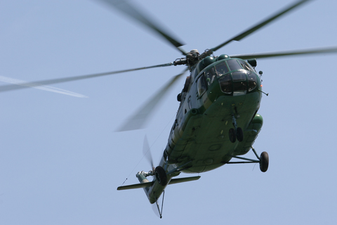 Mil Mi-8MTV-1, coded H-211, crossing low overhead during an ingress/egress practice session