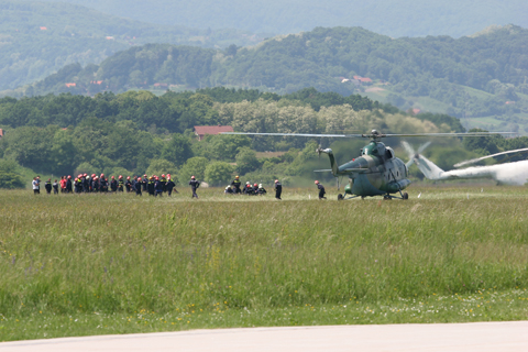 Waiting for their bus :). Almost 50 army skydivers wait patiently in line during rapid entry/exit exercises. As a bonus they would also get to fly a bit, as the air force prudently combined their exercises with the aforementioned ingress/egress flights to keep the pilots on their toes