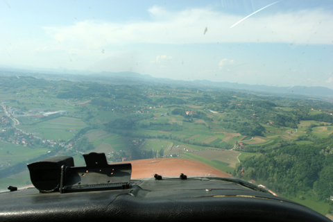 Diving on the stadium that can be seen just above the nose