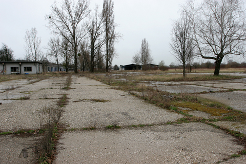 A view south from one of the paths leading to the apron. The pavement is apparently original from WW2 (or even before) though the buildings to the left and in the distance appear to be 70s vintage