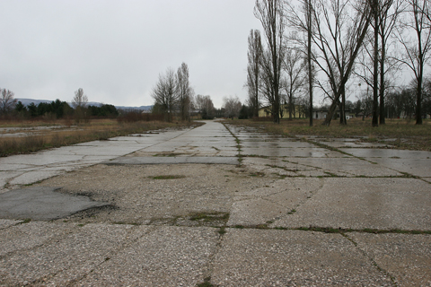 A view north. The yellow building in the distance is one of the very hangars that G.50 was photographed in front of. Beyond it is the disused rail yard - though trains regularly pass through it without stopping - seen in the reconaissance photo, as well as the field's own sideline
