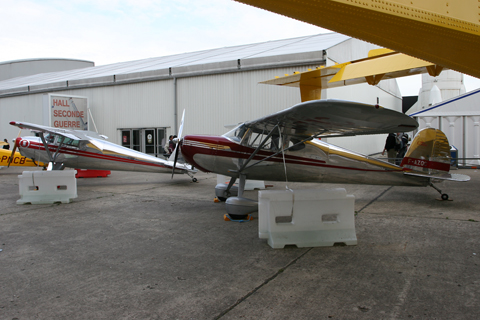 The two gems together behind the Dakota Hall at the museum. The intruding tail on the right belongs to a Canadair CL-415, in a bit of an odd shade of yellow