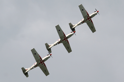 Flying follow the leader in perfect symmetry. At various points during their mass maneuvers, the aircraft are less than 2 meters apart