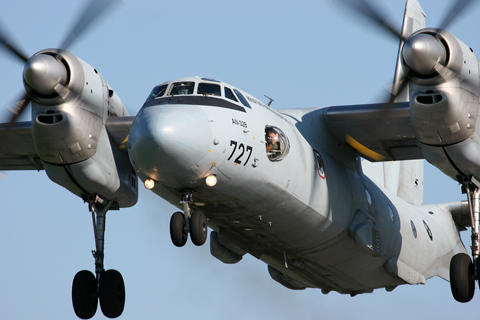 With its high.mounted engines, the An-32 is certainly a powerful sight. The navigator seems to be having fun :)