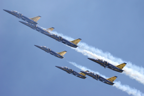 Flying through their own smoke during a mass formation maneuver. The world's first all-jet civilian display team, the BJT is composed entirely of former French Air Force pilots - some with flight hours running into 5 digits