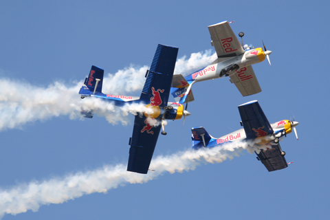 The Flying Bulls' trademark maneuver - a barrel roll around the mirror flight duo