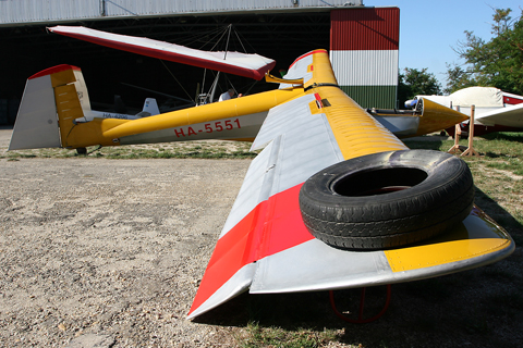 Something foreign for a change, taken at Farkashegy airfield just outside Budapest, Hungary. HA-5551 is a very rare Rubik R-26 Gobe, a type I think not seen outside Hungary. Seen here undergoing maintenance, the R-26 is one of the designs to come out of the pen of Erno Rubik Sr., father of the much more famous Erno Rubik Jr., inventor of the Rubik Cube