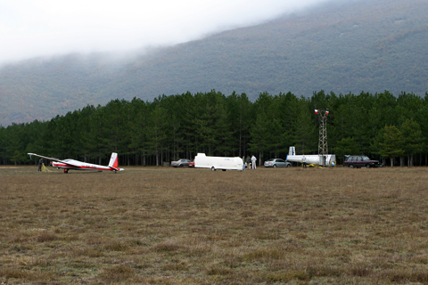 With some beautiful scenery in the back, 9A-DSI is seen waiting for the wind to subdue a bit. The other two gliders, a standard L-13 and a Pirat, didn't even bother getting off their trailers :)